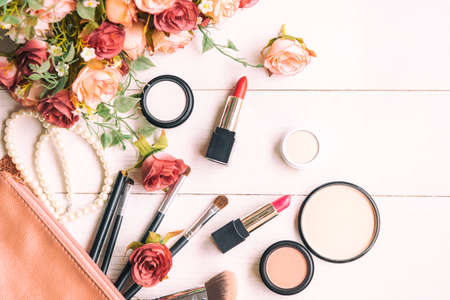 Valentine Gift. Makeup cosmetics tools background and beauty cosmetics, products and facial cosmetics package with flower rose and Pearl necklace. Lifestyle and Valentineの写真素材