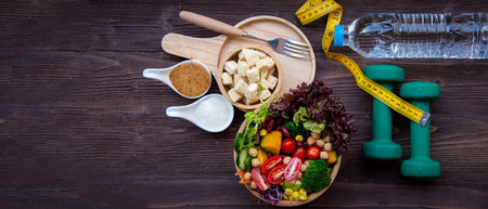Diet and Healthy life loss weight exercise Concept. Fresh vegetable salad with Weight scale measure prevention for women diet slimming. Lifestyle Time and Healthy, copy space for bannerの写真素材