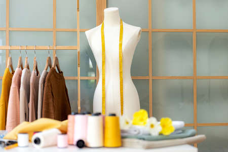 Select focus mannequins stylish tailor measurements and cloth rail for work designer in the showroom.  items and equipment material forground.  Business small Conceptの写真素材