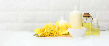 Soft and select focus. Thai Spa.  Hot stones setting for massage treatment and relax with yellow orchid on blackboard.  Lifestyle Healthy Concept,  copy space for banner, top viewの写真素材