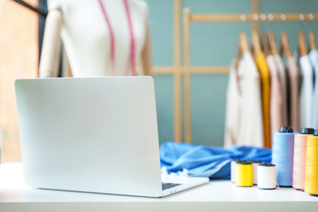 Close up designer fashion items and equipment material for work designer in the showroom. Mannequins stylish tailor measurements and cloth rail background.  Business small Conceptの写真素材
