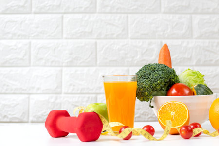 Healthy care for body slim.  Diet and healthy fresh vegetable for detox body slim fit for health lifestyle, Sport exercise equipment workout,  white background. Weight Loss and Diet Conceptの写真素材
