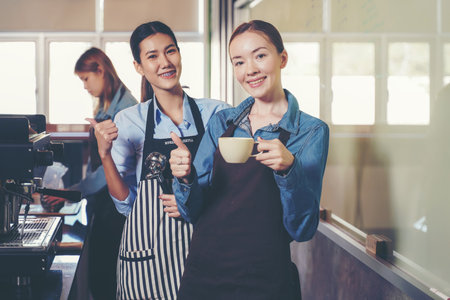 Group woman people leaning and education workshop for classes barista coffee in cafe room.  Preparing teacher meeting and training service about hospitality and make coffee.  Education Conceptの写真素材