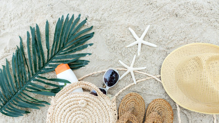 Summer Fashion woman sunblock with accessories item go to travel in the beach. Tourism travel on holiday happy leisure and destination trip.  Sand beach background. Summer and Travel Conceptの写真素材