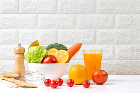 Select focus. Diet and healthy fresh vegetable fruits for detox body slim fit for health lifestyle with Sport exercise equipment workout and orange juice,  white background. Weight Loss and Diet Conceptの写真素材