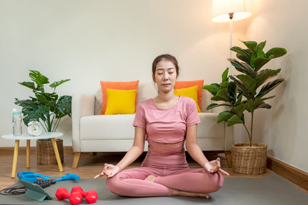 Lifestyle woman yoga exercise and pose for healthy life.Â  Young girl or people pose balance body vital zen and meditation for workout and fitness sport in living room on line. Health care Conceptの写真素材
