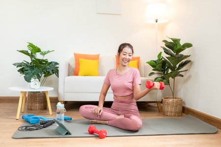 Healthy lifestyle young woman fitness gym for body slim. Young people girl exercise at living room on line. Fitness instructor exercising the fitness. Diet and Healthy sport Conceptの写真素材