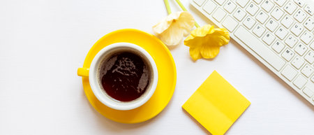 Healthy care with working in the office.  Yellow cup black coffee for diet Health life with keyboard...