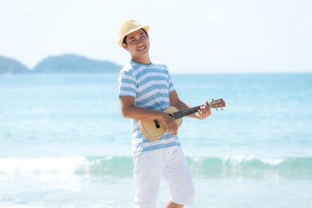 Asia lifestyle man relax and dance music enjoy  in luxury resort near the beach in Summer holiday.  Tourism travel pointing future destination leisure tropical island. Travel Trips Conceptの写真素材