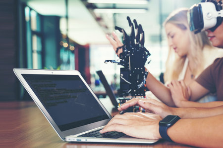 Close up hands man.  Group team work programer and engineer working AI robot arm system.  Business people Start-up production process technology and logic control constructing arm system projectの写真素材