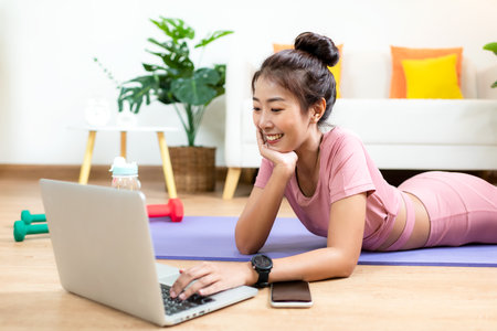 Healthy lifestyle young woman fitness gym for body slim. Young people girl exercise at living room on line. Fitness instructor exercising the fitness. Diet and Healthy sport Conceptの写真素材