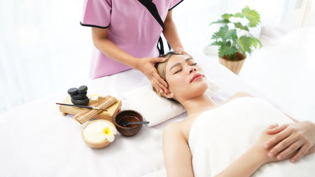 Woman spa body and face treatment and massage aroma therapy product relax and healthy and beauty. Spa Thai therapy treatment aromatherapy for body woman. Young woman enjoying and relax massage in spa salonの写真素材