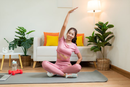 Healthy lifestyle young woman fitness gym for body slim. Young people girl exercise at living room on line. Fitness instructor exercising the fitness. Diet and Healthy sport Conceptの写真素材