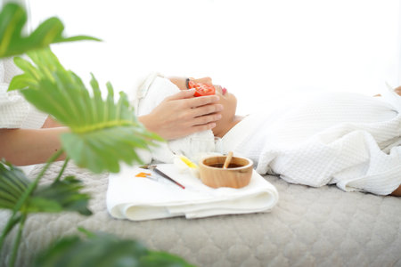 Masseuse masking face with tomato and spa face woman treatment and massage aroma therapy relax enjoying and healthy and beauty. Spa Thai therapy treatment aromatherapyの写真素材