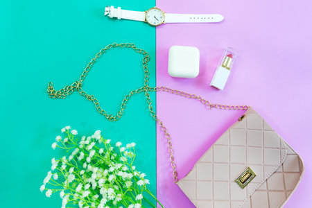 Fashion stylish yellow bag and woman accessories pastel background. Trendy fashion luxury handbag, perfume and cosmetic design. Lifestyle and Beauty Conceptの写真素材