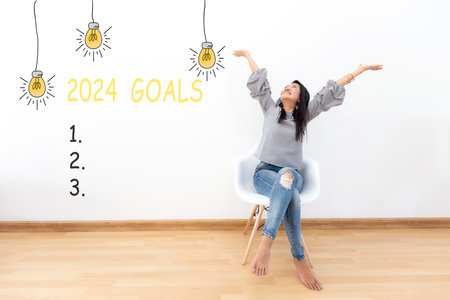 2024 goals with young woman cheerful and happy new year on the chair.  Star together new year 2024の写真素材