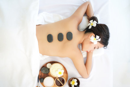 Spa beauty massage healthy wellness.  Spa Thai therapy treatment aromatherapy for body woman. Young woman enjoying and relax massage in spa salon. Lifestyle and Cosmetic Healthyの写真素材