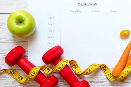 Diet Health Plan. Workout planing. Sport exercise equipment workout andÂ gym background with nutrition fresh salad for fitness style. Healthy Lifestyle Conceptの写真素材