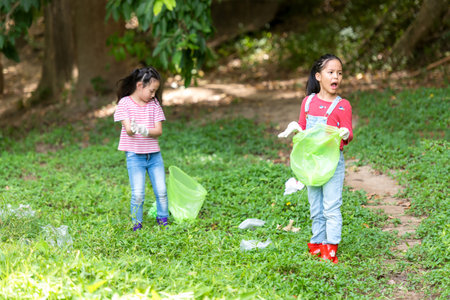 Group student Charity and recycle plastic for environment.  People asia girl  and boy collecting...