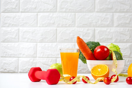 Select focus. Diet and healthy fresh vegetable for detox body slim fit for health lifestyle with Sport exercise equipment workout and milk. Weight Loss and Diet Conceptの写真素材