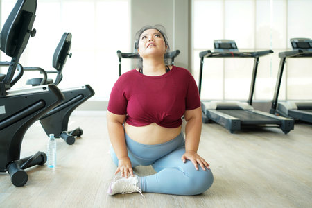 Asian woman fitness exercise for lose weight. People overweight training and exercising sport in the gym for body healthy. Healthy Lifestyle Conceptの写真素材