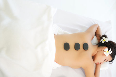 Asia woman spa body treatment and massage aroma therapy product relax and healthy and beauty. Spa Thai therapy treatment aromatherapy for body and face. Young woman enjoyingの写真素材