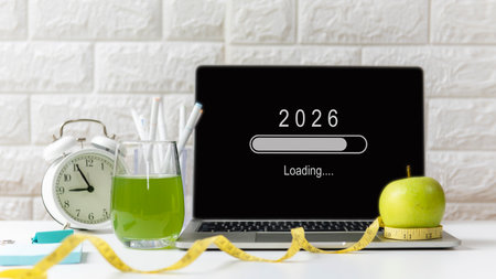 Loading year 2026 for start new business and new life. Healthy  fresh healthy salad and vegetable green water for diet with working in officeの写真素材