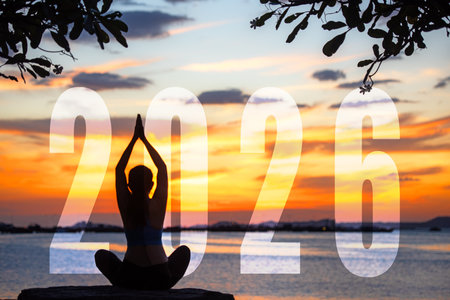 Happy new year card 2026. Silhouette lifestyle woman yoga practicing yoga standing as part of Number...