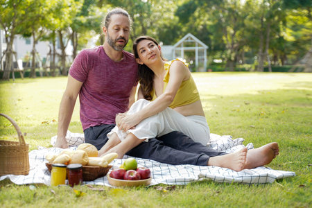 Happy family picnic in the park public on summer holiday.  Family relax and enjoying outdoor.  Family and Lifestyle Conceptの写真素材