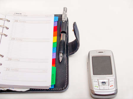 Office objects - Pen diary  and a cell phone の写真素材