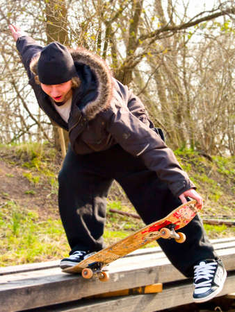 Urban Lifestyle -Young teenage skatboarder practicing his tricks