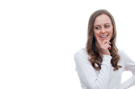 Happy young woman looking towards copy space の写真素材