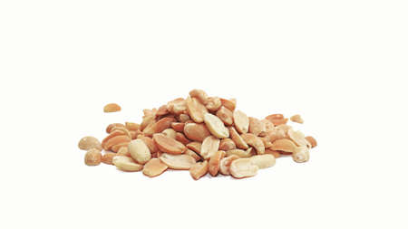 Salty, fried peanuts. Isolated on white backgroundの写真素材