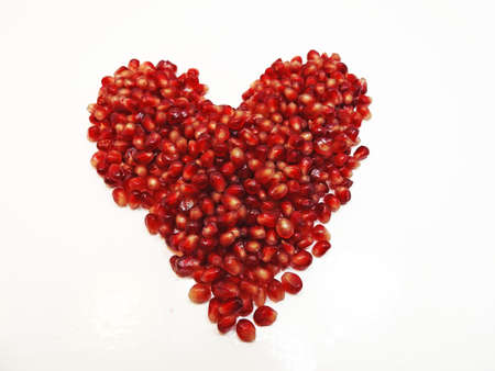 Red fresh pomegranate isolated on white backgroundの写真素材