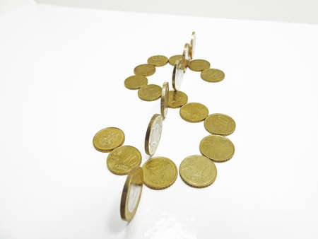 Dollar symbol build from coins on white backgroundの写真素材