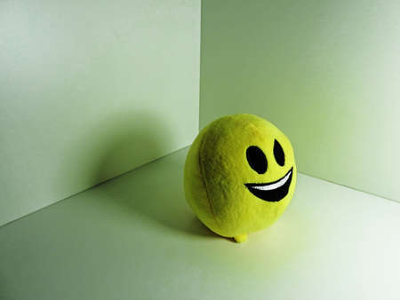 Children toy. Yellow round slime with small legs.の写真素材