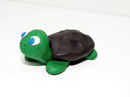 Green small turtle made from color plasticineの写真素材