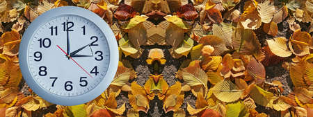 Isolated electronic wall clock. Goes to Winter timeの写真素材