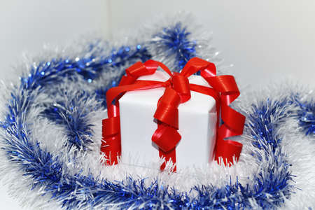 White presents with red ribbons, isolated on white background.