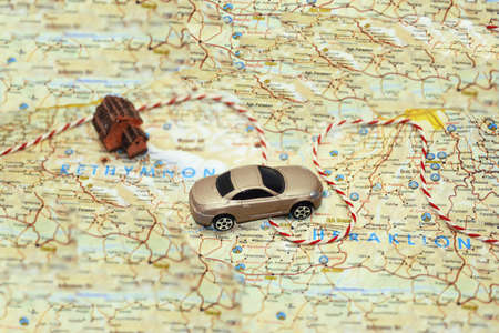 Abstract idea of rent a car. Small car on map.の写真素材