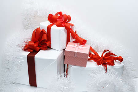 White presents with red ribbons, isolated on white background.の写真素材