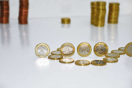 Euro coins on white table. Abstract composition. European currencyの写真素材