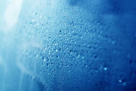 Drops of water on wet window.の写真素材