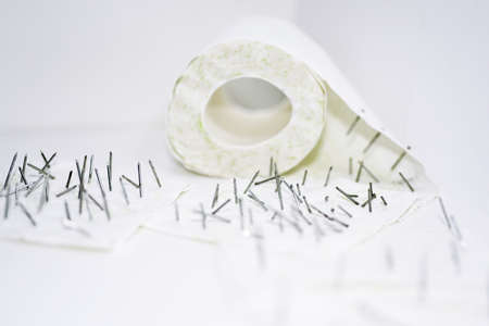 Toilet paper with nails in it.の写真素材