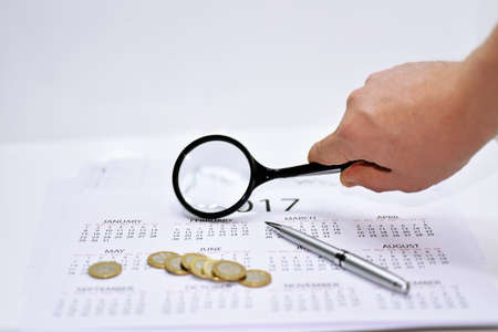 Abstract composition of making year plans. Mans arm with 2017 calendar.の写真素材