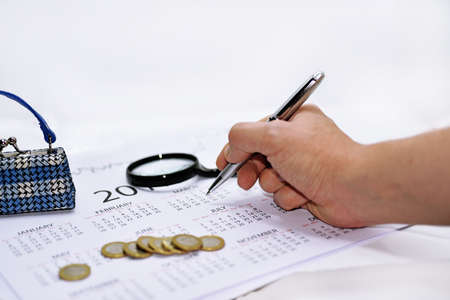 Abstract composition of making year plans. Mans arm with 2017 calendar.の写真素材