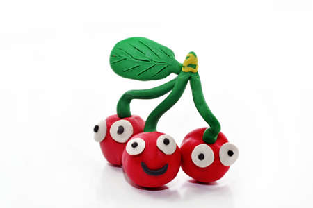 Cherry made from plasticine. Isolated on white backgroundの写真素材