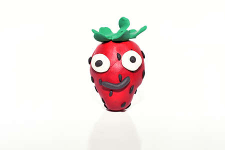 Strawberry made from plasticine. Isolated on white background.の写真素材