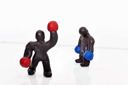 Boxing figures from plasticine. Isolated on white background.の写真素材