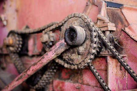Old iron chain in retro machine. Abstract photo of industry.の写真素材